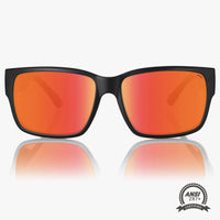 Sunglasses with black frame and red-orange lenses on a white background, featuring ANSI Z87+ certification logo.