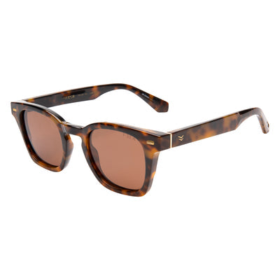 Sunglasses with tortoiseshell frame and brown lenses on a white background
