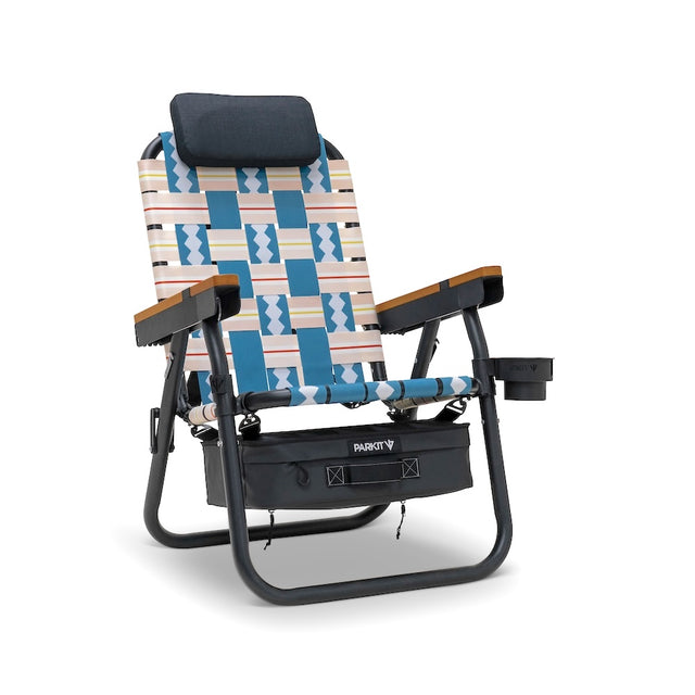 Colorful reclining chair with geometric pattern on a white background