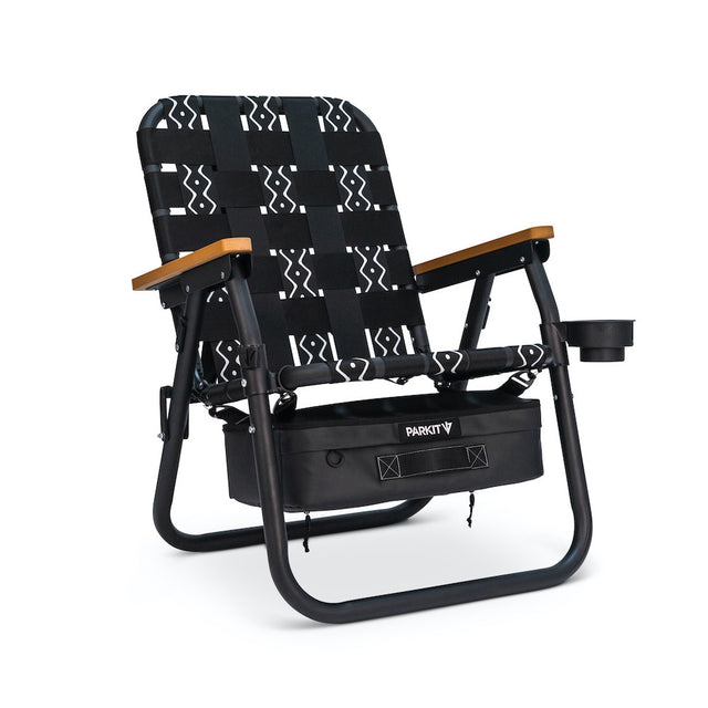 Black and white patterned chair with wooden armrests on a white background