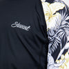 Detail view of girls black rashguard with floral print sleeves