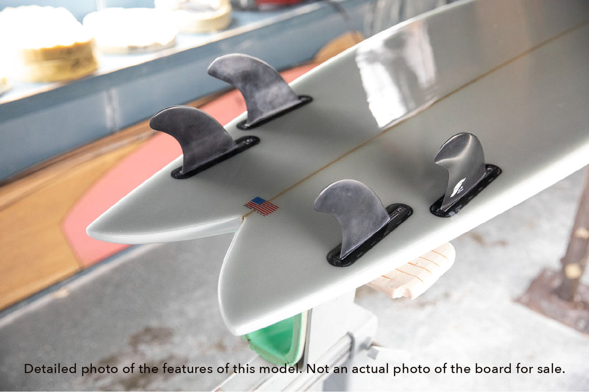 detail of the tail and fins included on a Stewart Retro Fish shortboard surfboard