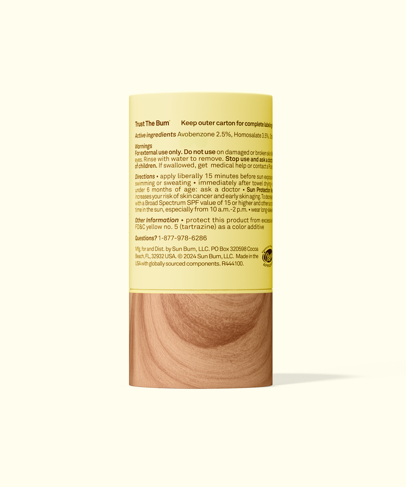 Wooden container with a yellow label on a white background