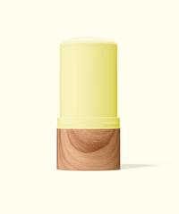 Two-toned cylindrical container with yellow top and wooden bottom on a white background