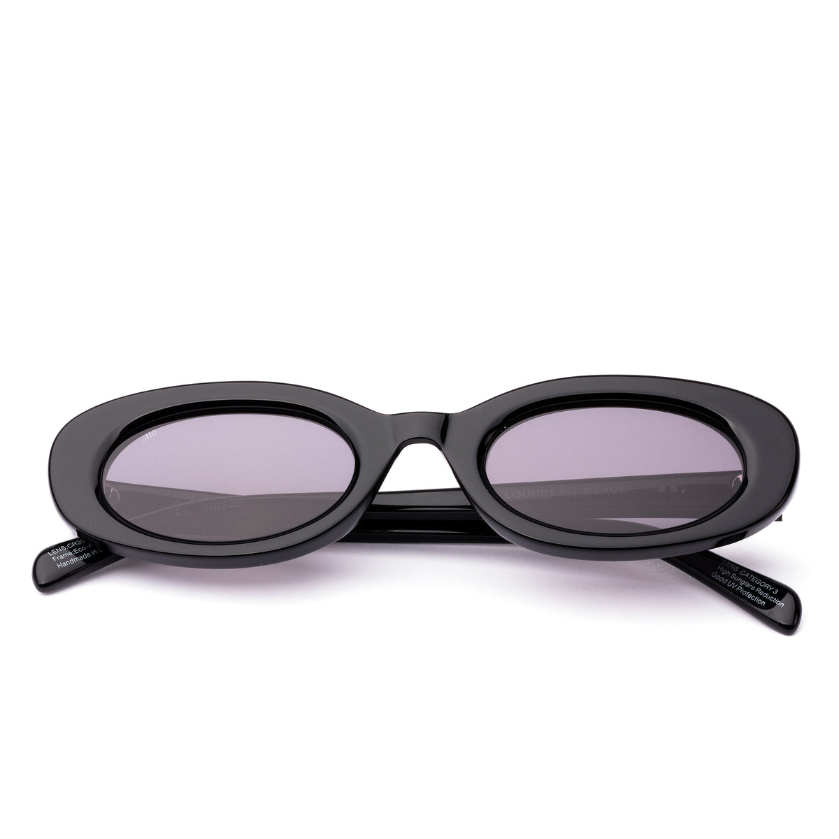 Sunglasses with black frame and grey lenses on a black  background