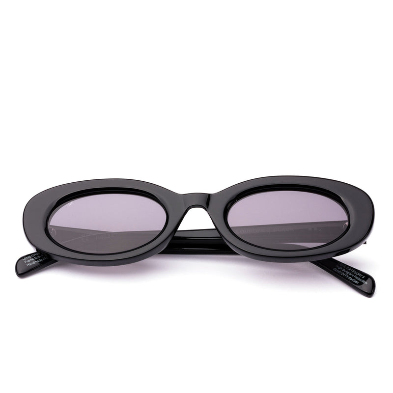 Sunglasses with black frame and grey lenses on a black  background