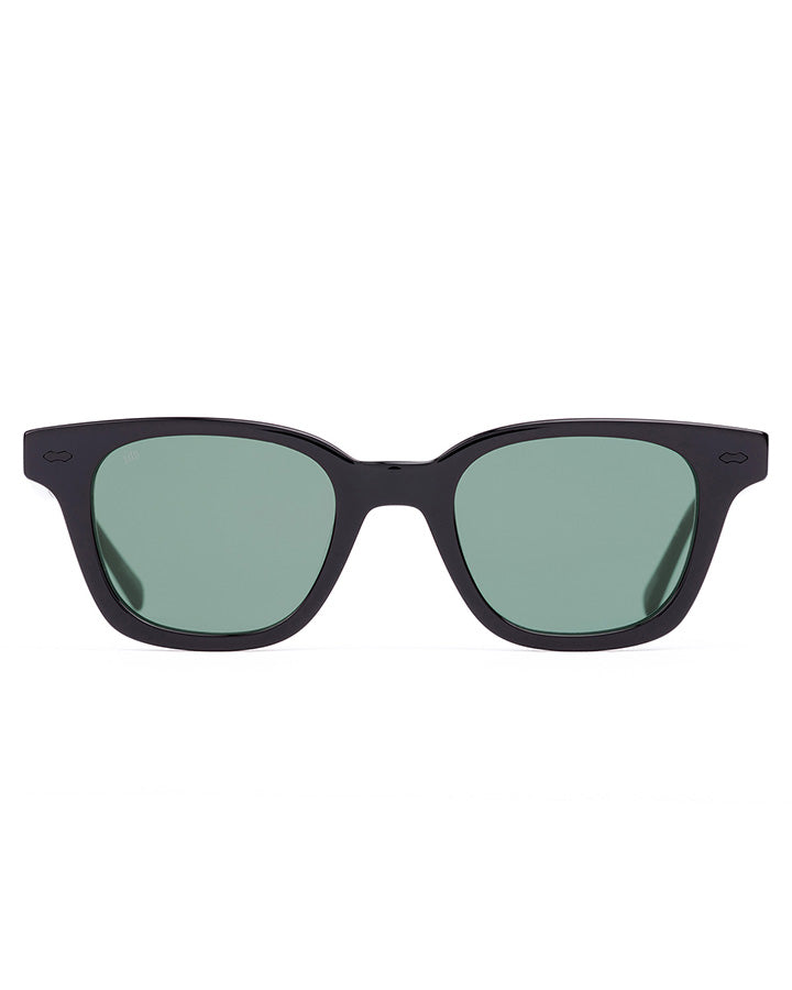 Black sunglasses with green lenses on a white background