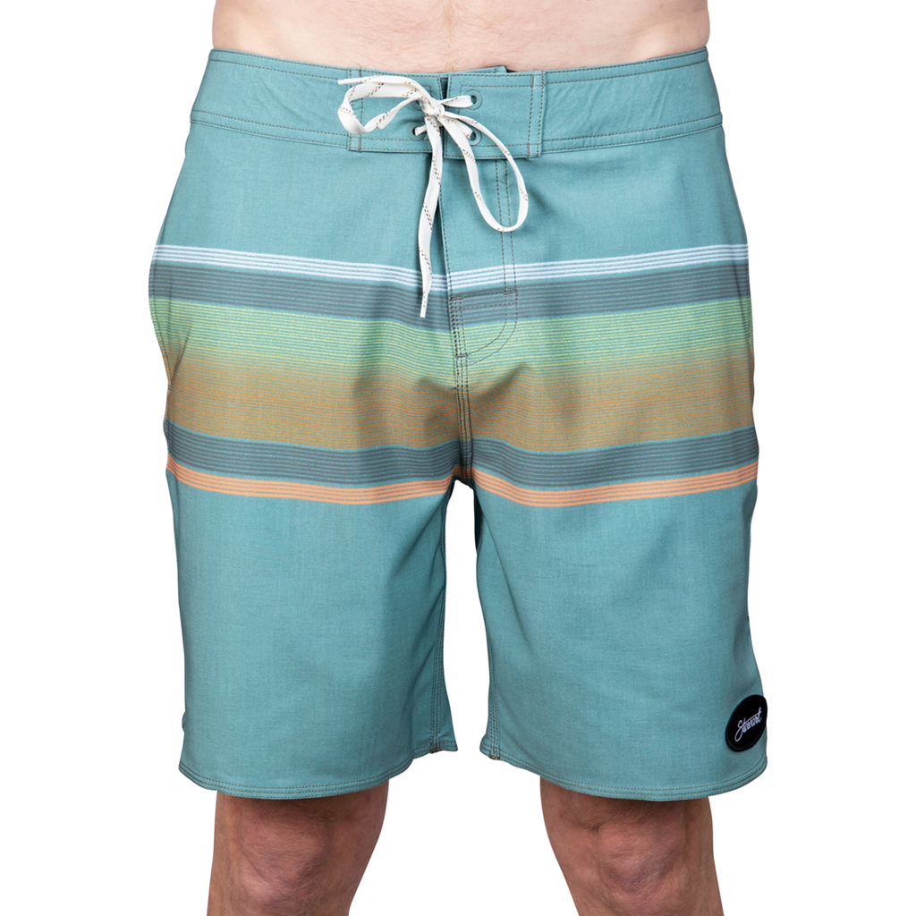 Front view teal boardshorts with stripes on model