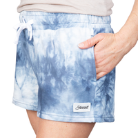 Front view of navy tie-dye shorts on model
