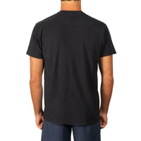 A man viewed from the back wearing a plain black short-sleeve crewneck t-shirt and navy blue pants, set against a solid white background.