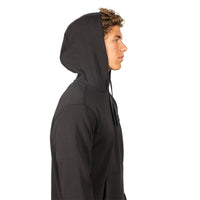 A man in profile wearing a black pullover hoodie against a solid white background.