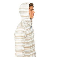 A man shown in profile wearing a hooded long-sleeve shirt with horizontal beige and white stripes, set against a plain white background.