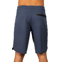 Rear view of a person wearing navy blue athletic shorts with a black zippered pocket on the upper left side, shown against a plain white background.