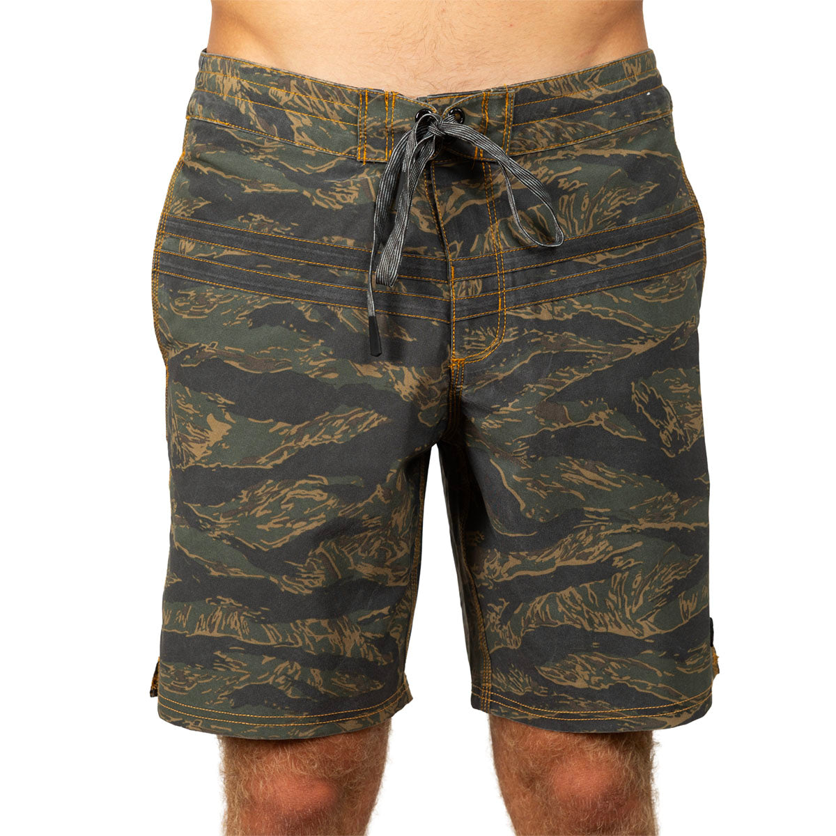 Men's board shorts with an all-over tiger stripe camouflage pattern in olive green, black, and tan, featuring a dark drawstring waist.