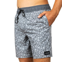 Gray and white patterned swim trunks with a dark gray elastic waistband and black drawstring, shown on a model against a white background.