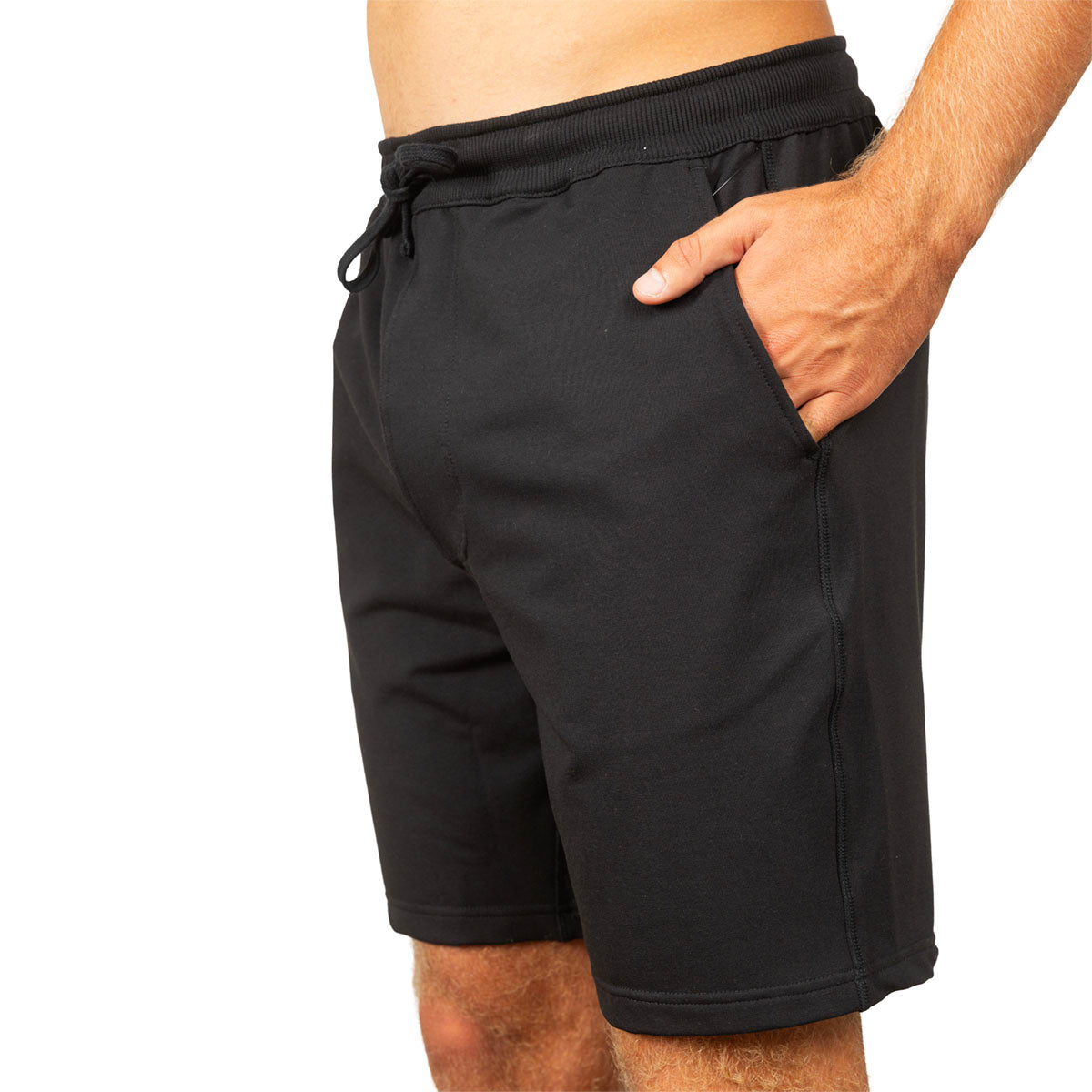 Black athletic shorts with an elastic drawstring waist and side pockets, shown on a model against a white background.