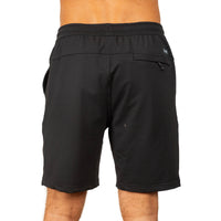 Black athletic shorts with an elastic waistband and zippered side pocket, shown from the back on a model against a white background.