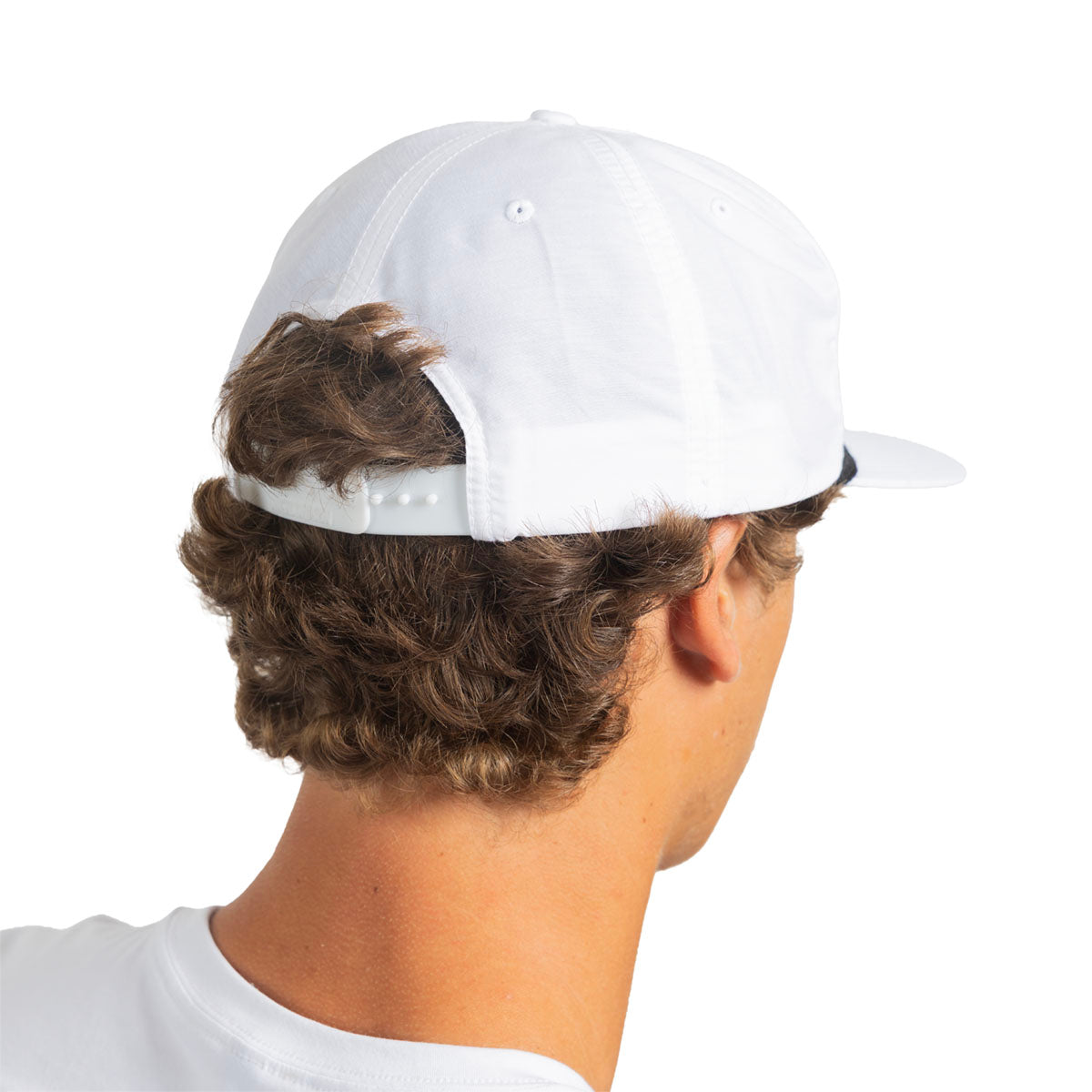 A man shown from the back wearing a white baseball cap with a curved brim and an adjustable snapback strap, against a plain white background.