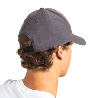 A man shown from the back wearing a dark heather gray baseball cap with a black adjustable strap, against a plain white background.