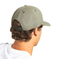A man shown from the back wearing an olive green baseball cap with a curved brim and an adjustable strap, against a plain white background.