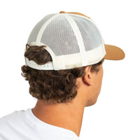 A man shown from the back wearing a white mesh trucker-style cap with a tan crown and visor, photographed against a plain white background.