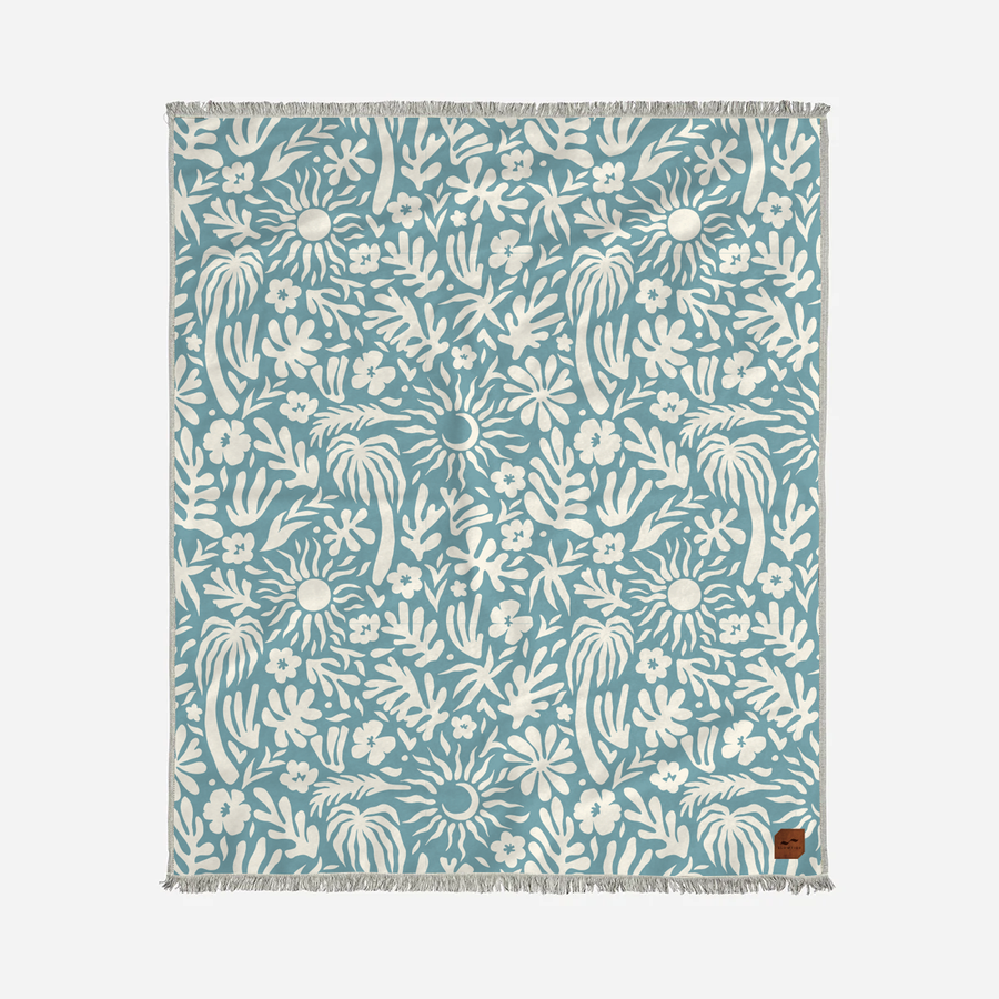 Floral patterned TOWEL with white design on a blue background
