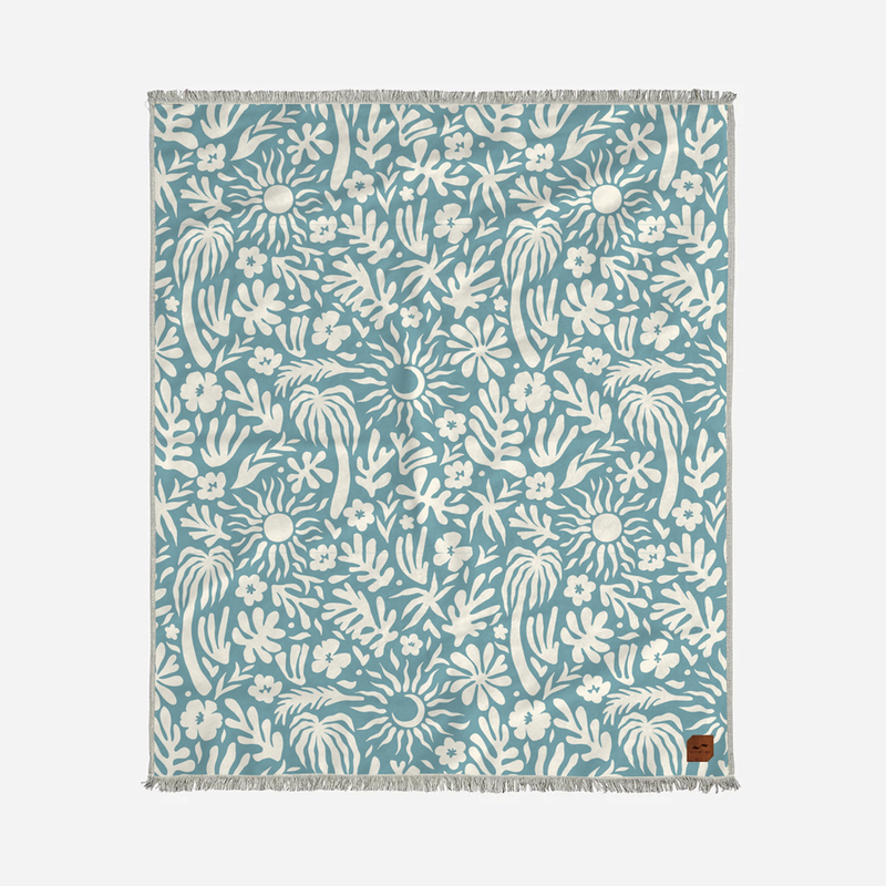 Floral patterned TOWEL with white design on a blue background