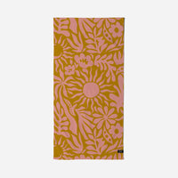 Floral patterned towel with pink flowers on a yellow background