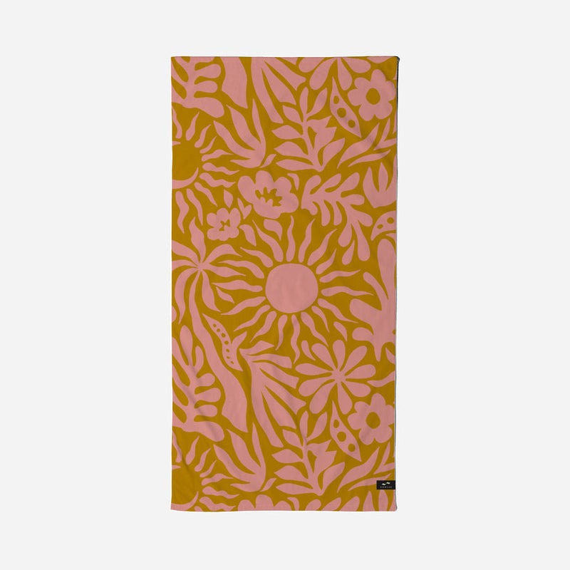 Floral patterned towel with pink flowers on a yellow background