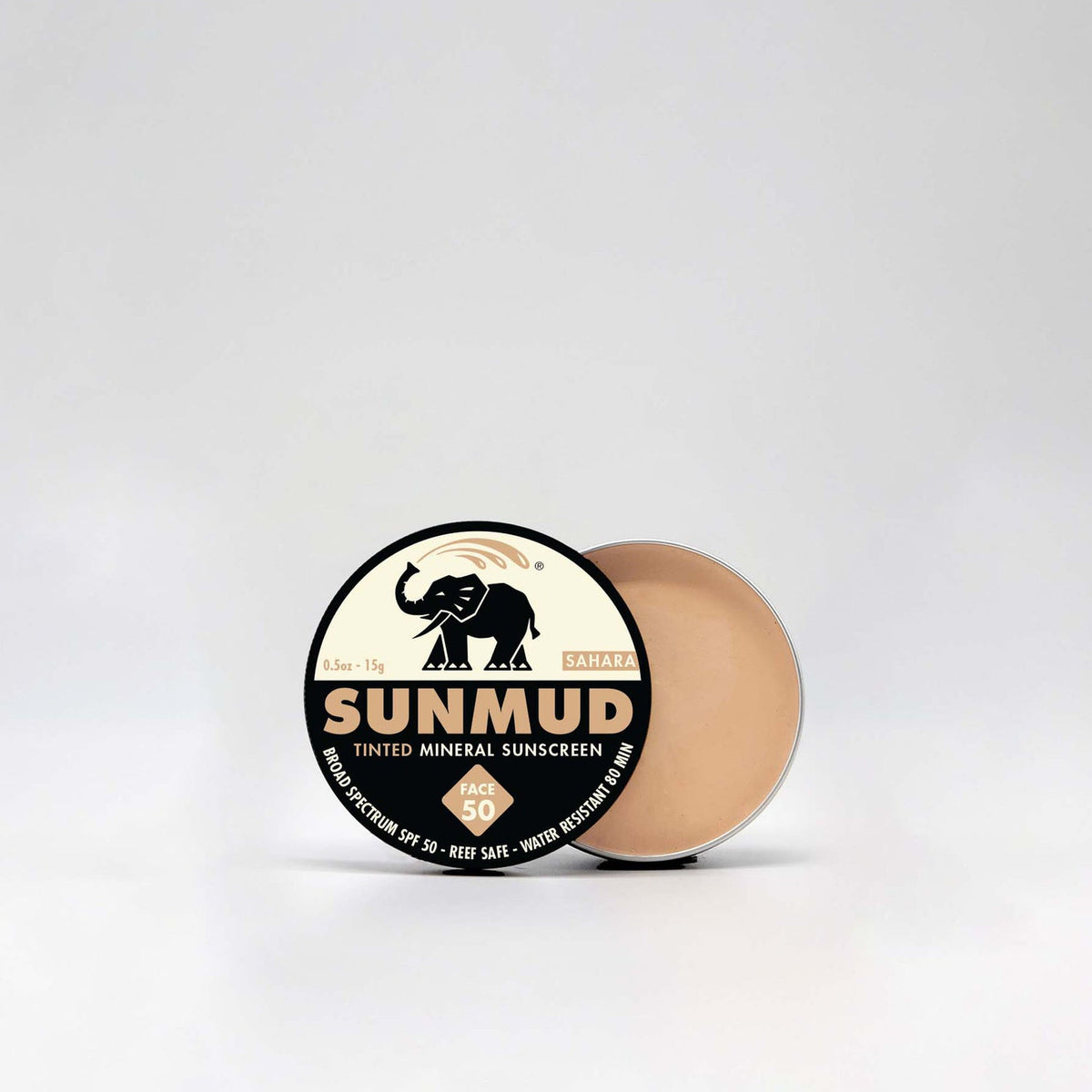 Sunmud tinted mineral sunscreen with a black and gold label on a white background