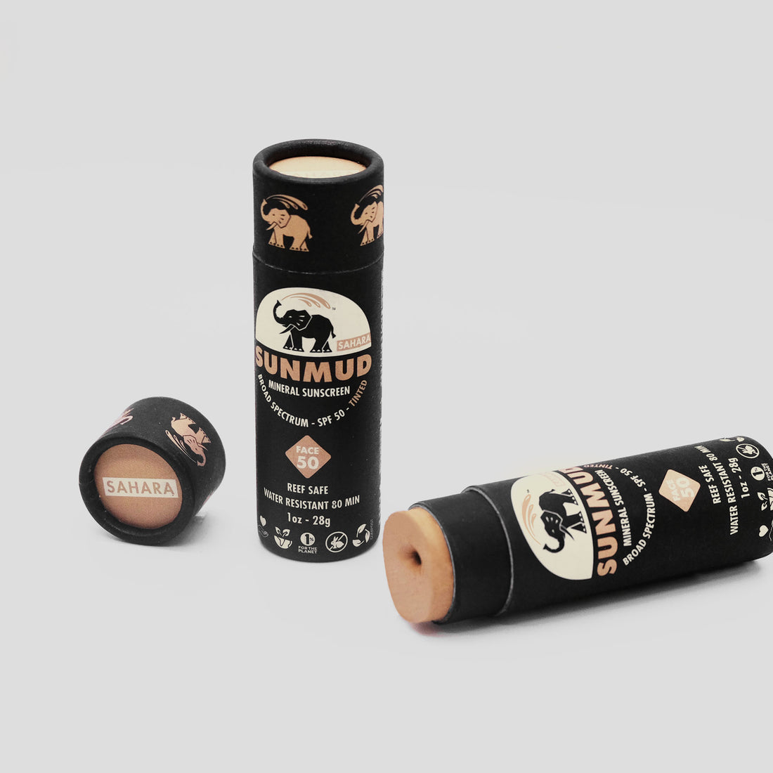 Sunmud mineral sunscreen sticks on a light gray background
