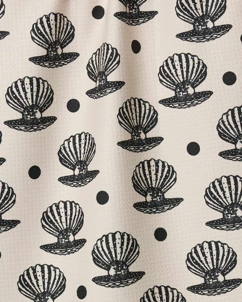 Pattern of black shell designs on a beige background