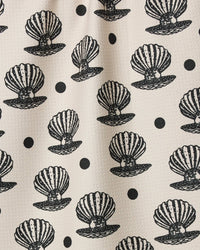 Pattern of black shell designs on a beige background