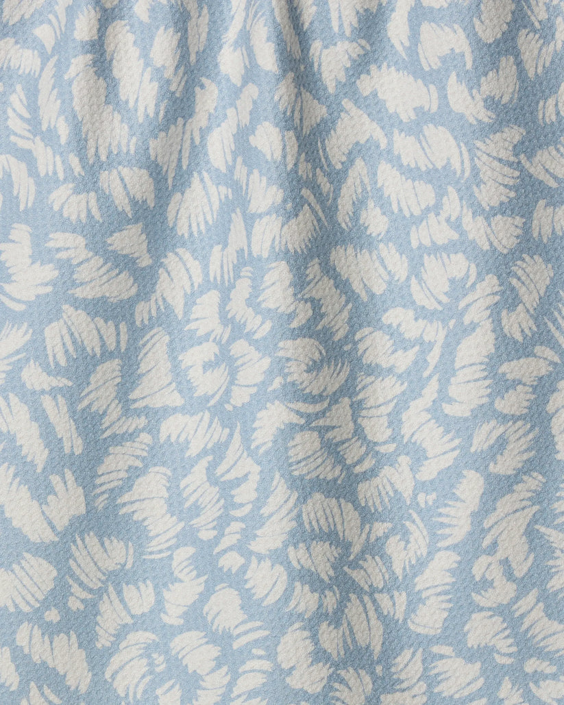 Textured fabric with a leaf pattern in light blue and white