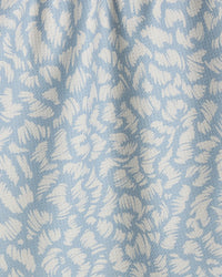 Textured fabric with a leaf pattern in light blue and white