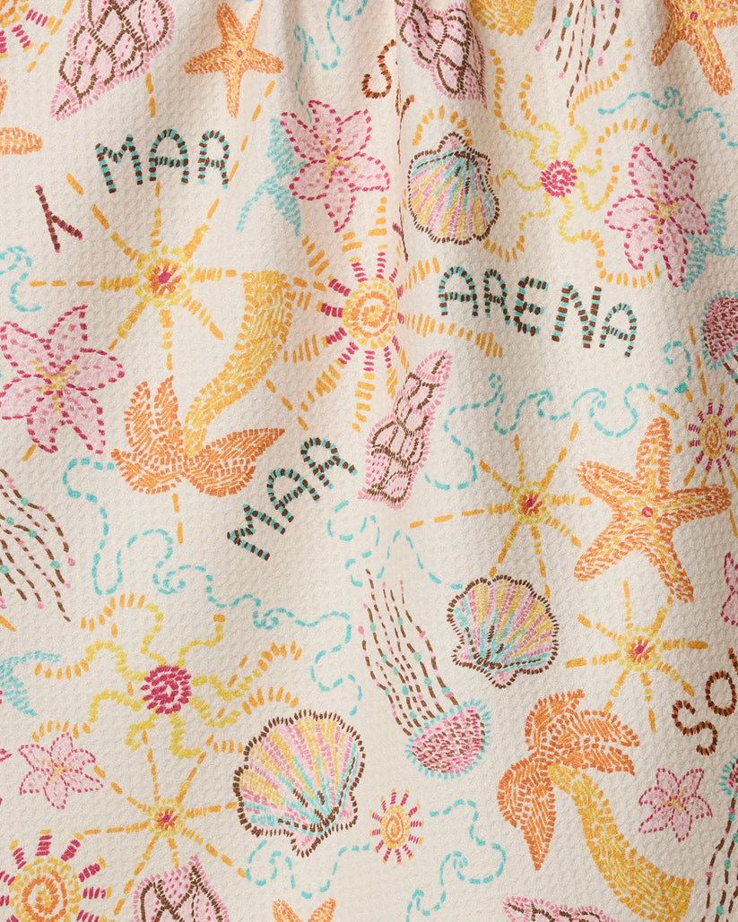 Textile with sea-themed embroidery including stars, shells, and flowers on a beige background.