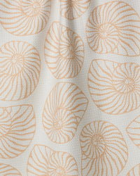 Pattern of shell-like shapes in orange on a beige background