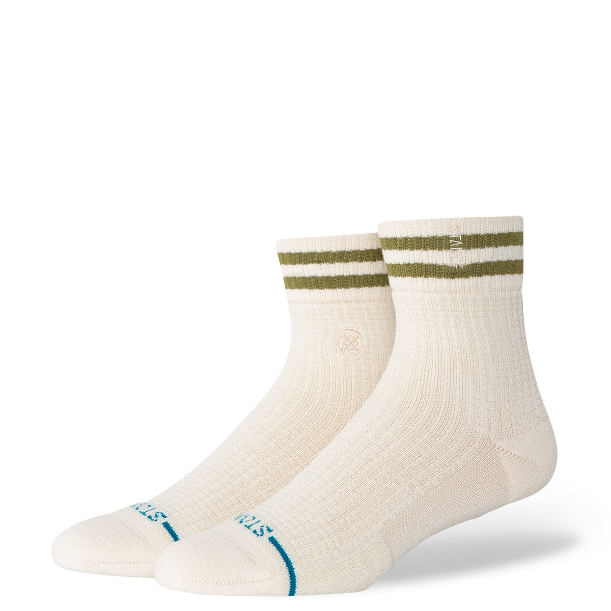 Pair of cream socks with green and blue accents on a white background