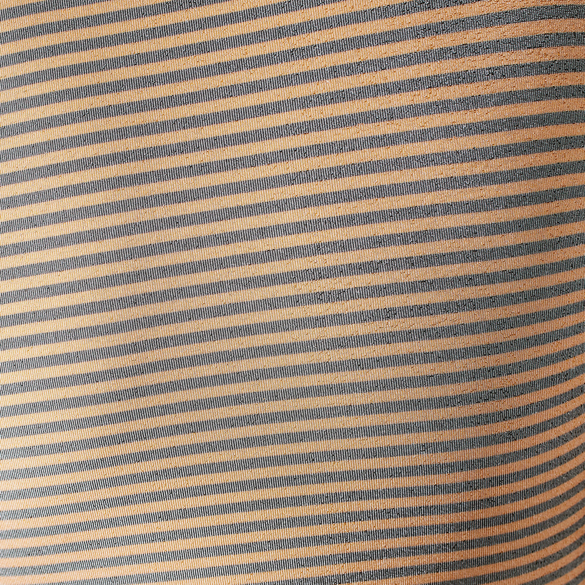 Close-up of fabric with blue and beige horizontal stripes