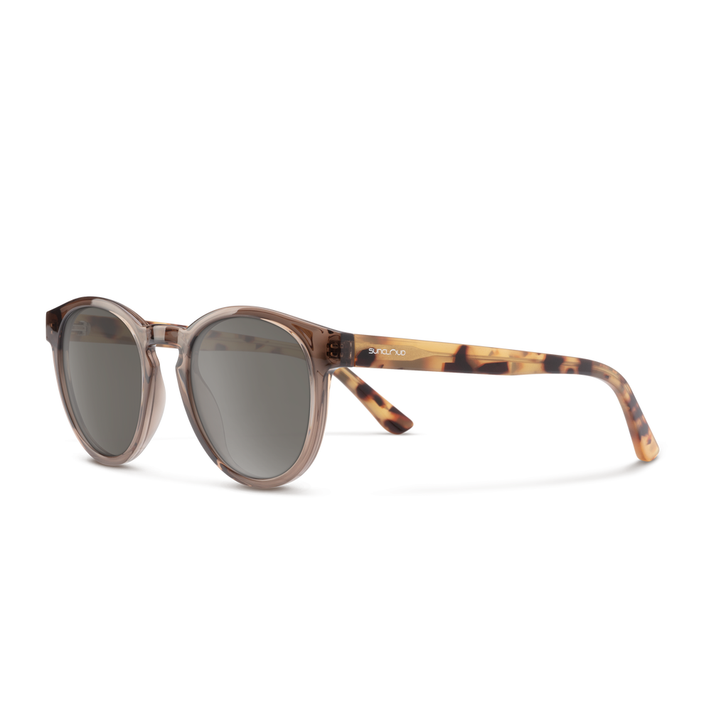 Sunglasses with tortoiseshell frame and dark lenses on a white background