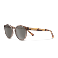 Sunglasses with tortoiseshell frame and dark lenses on a white background