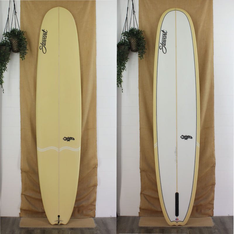 stewart bird longboard with a tan reverse layup and white "bird" pinlines on deck  