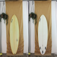 Yellow and white, mid length, 3 fin Stewart surfboard