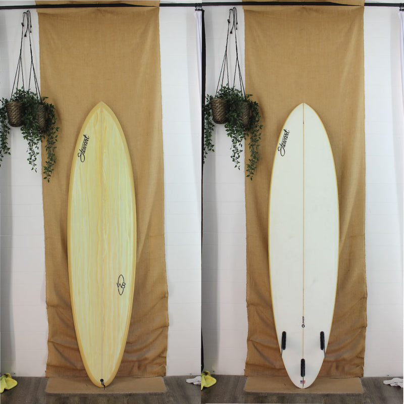 Yellow and white, mid length, 3 fin Stewart surfboard