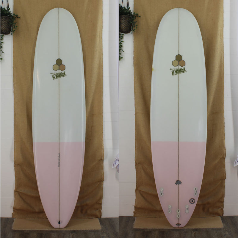 Deck and bottom view of a used Channel Islands Mid Length  with Clear resin tint and gloss finish and a pink tail