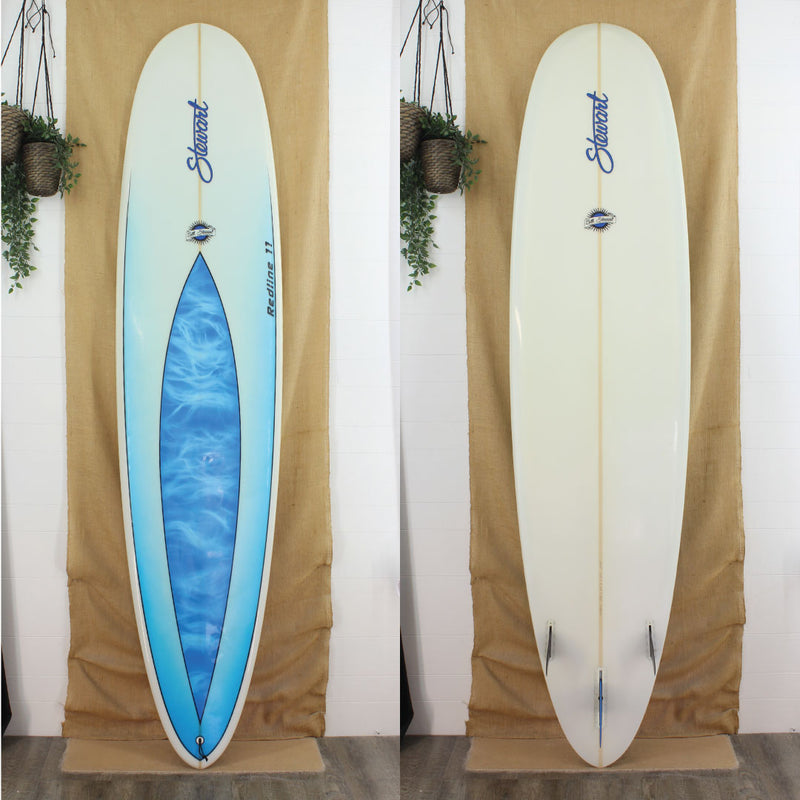 Deck and bottom view of a used Stewart Redline 11 Longboard with a blue swirl in the middle than fades from blue to white bottom to top with a gloss and polish finish  