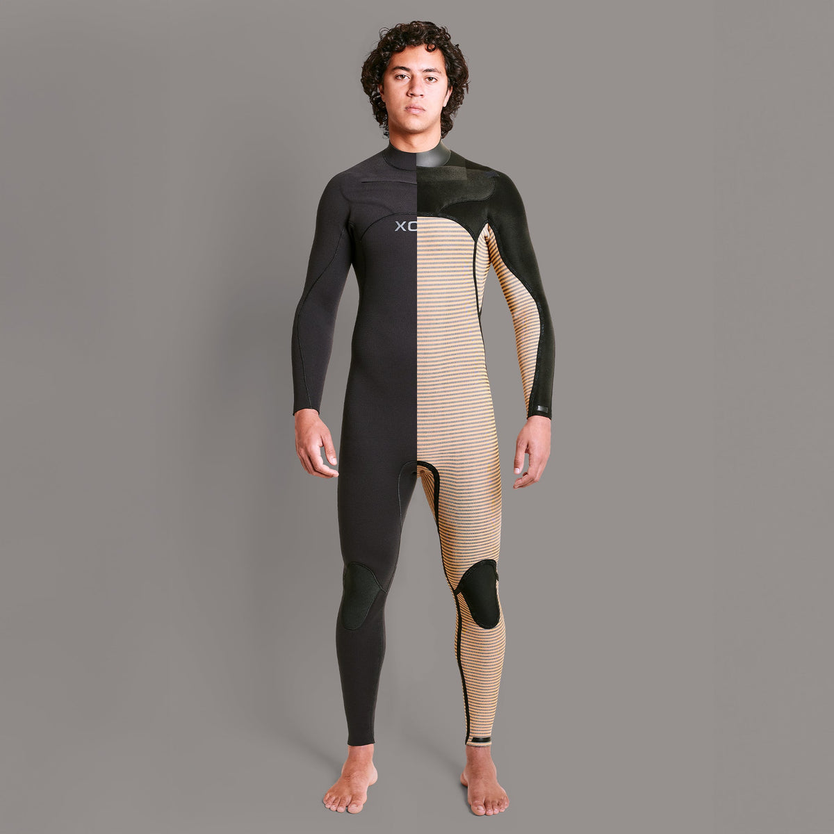 Person wearing a black and beige wetsuit on a gray background