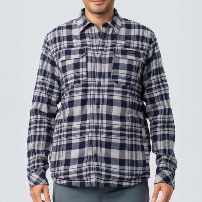 Person wearing a blue and white plaid shirt on a light gray background