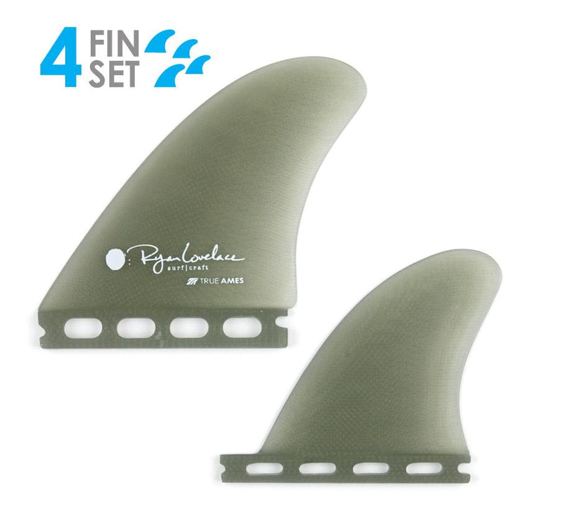 Two green surfboard fins with branding on a white background