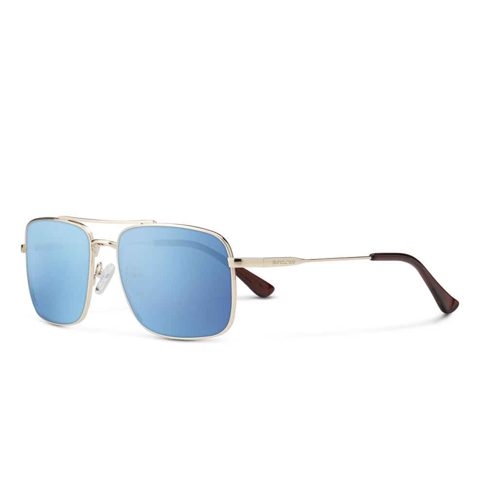 Sunglasses with gold frame and blue lenses on a white background